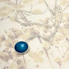 Load image into Gallery viewer, Silver and kingfisher blue halo necklace.

