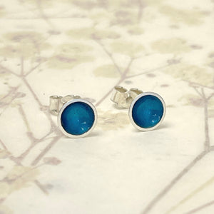 Silver and kingfisher blue enamel studs.