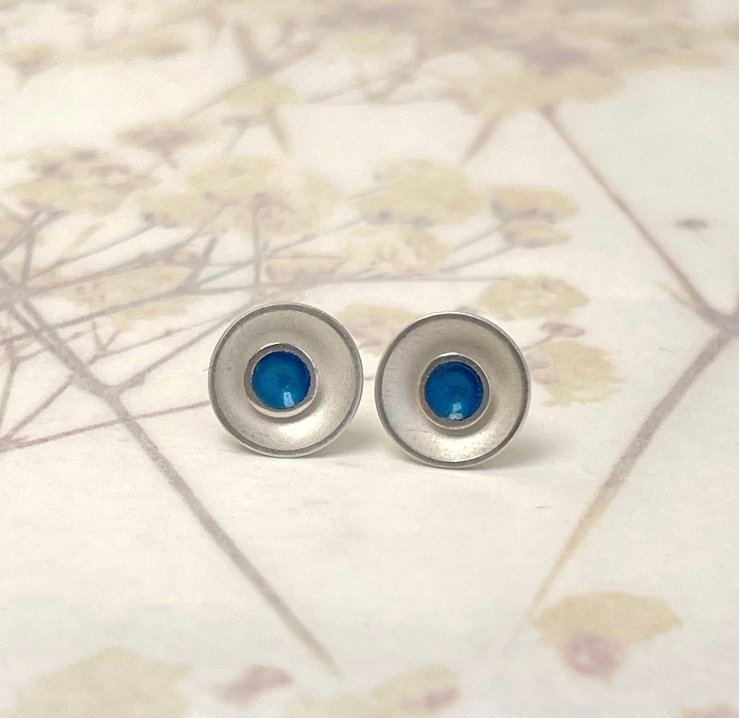 Silver and kingfisher blue enamel earrings.