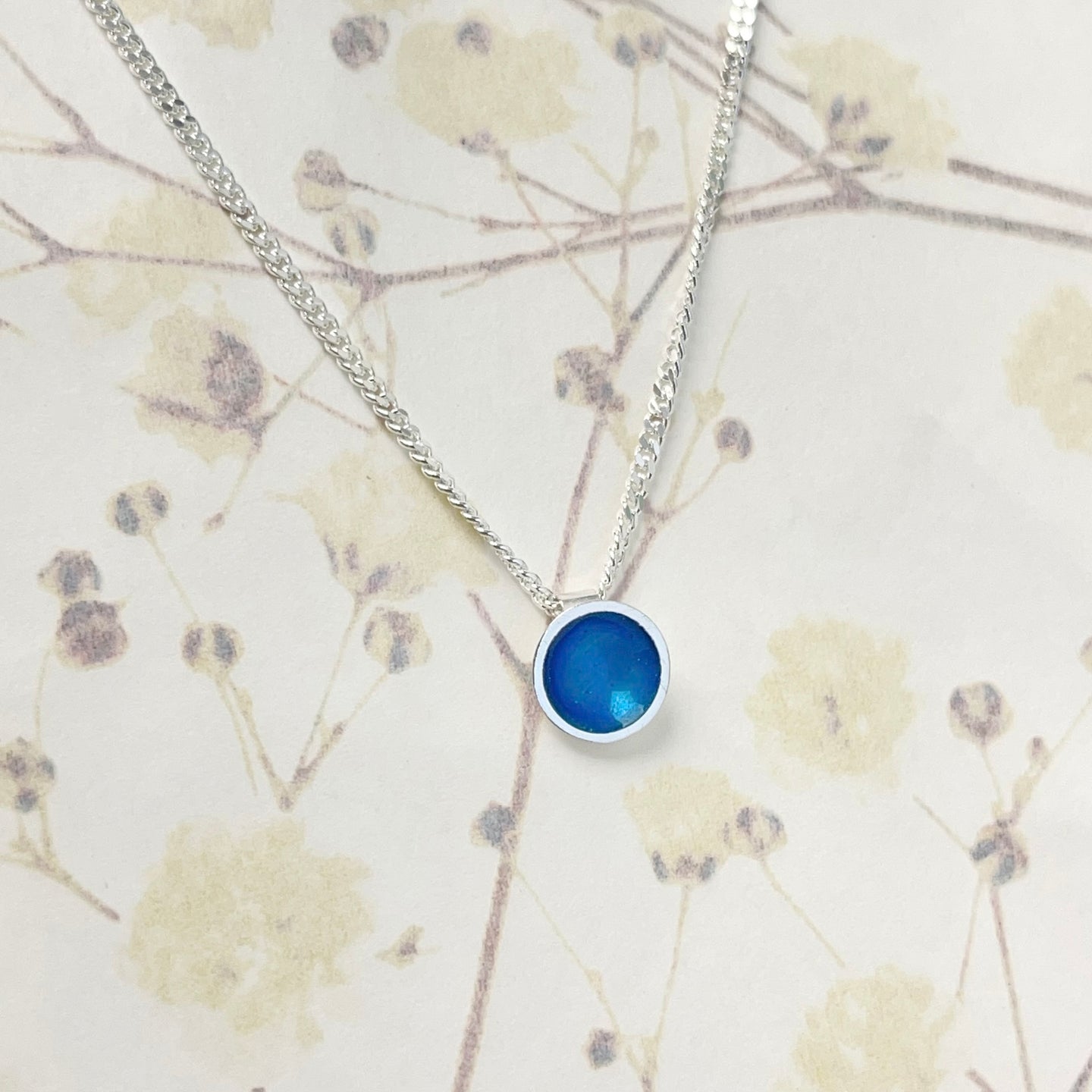 Tiny silver and kingfisher blue enamel necklace