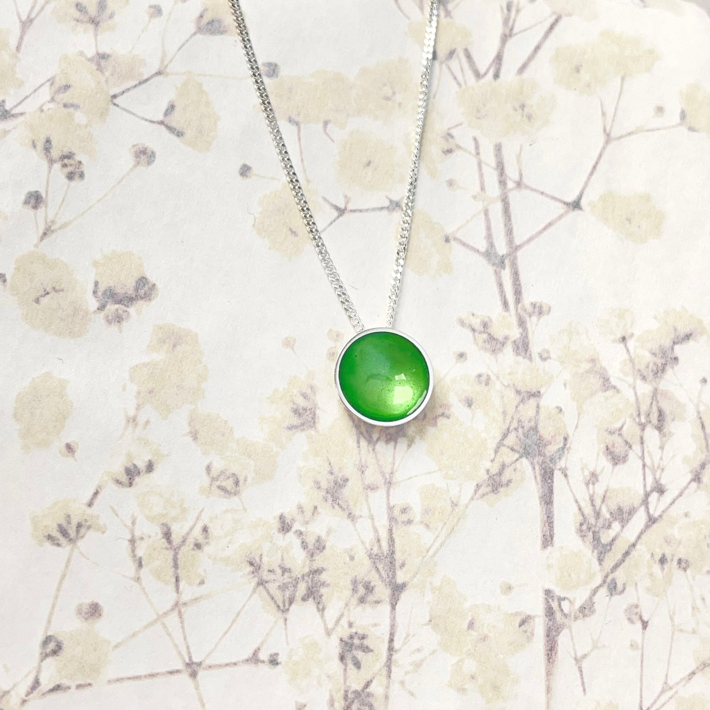 Silver and grass green enamel necklace.