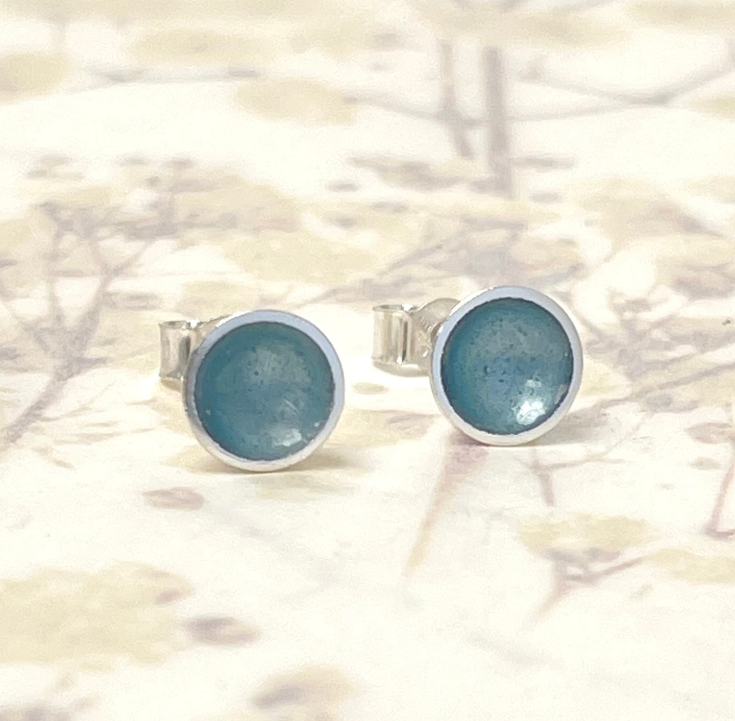 Silver and ice blue enamel studs