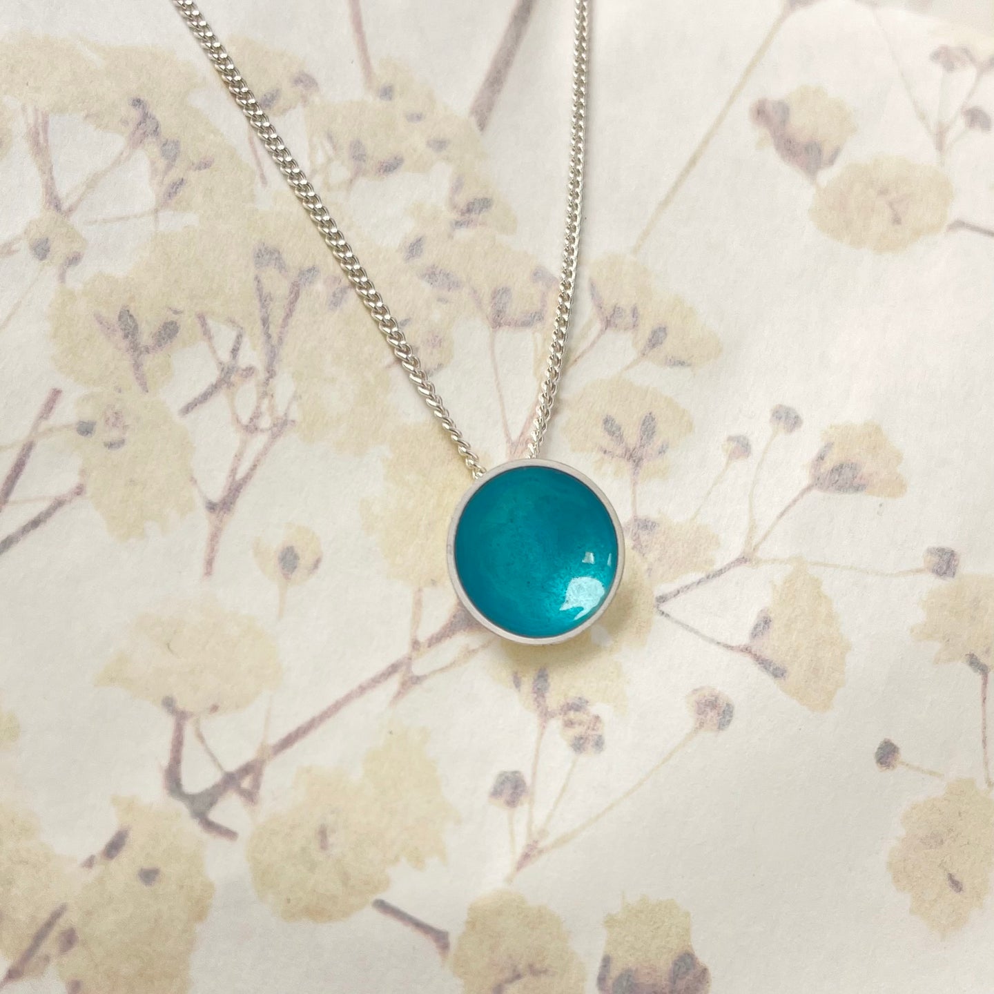 Silver and teal halo disc necklace