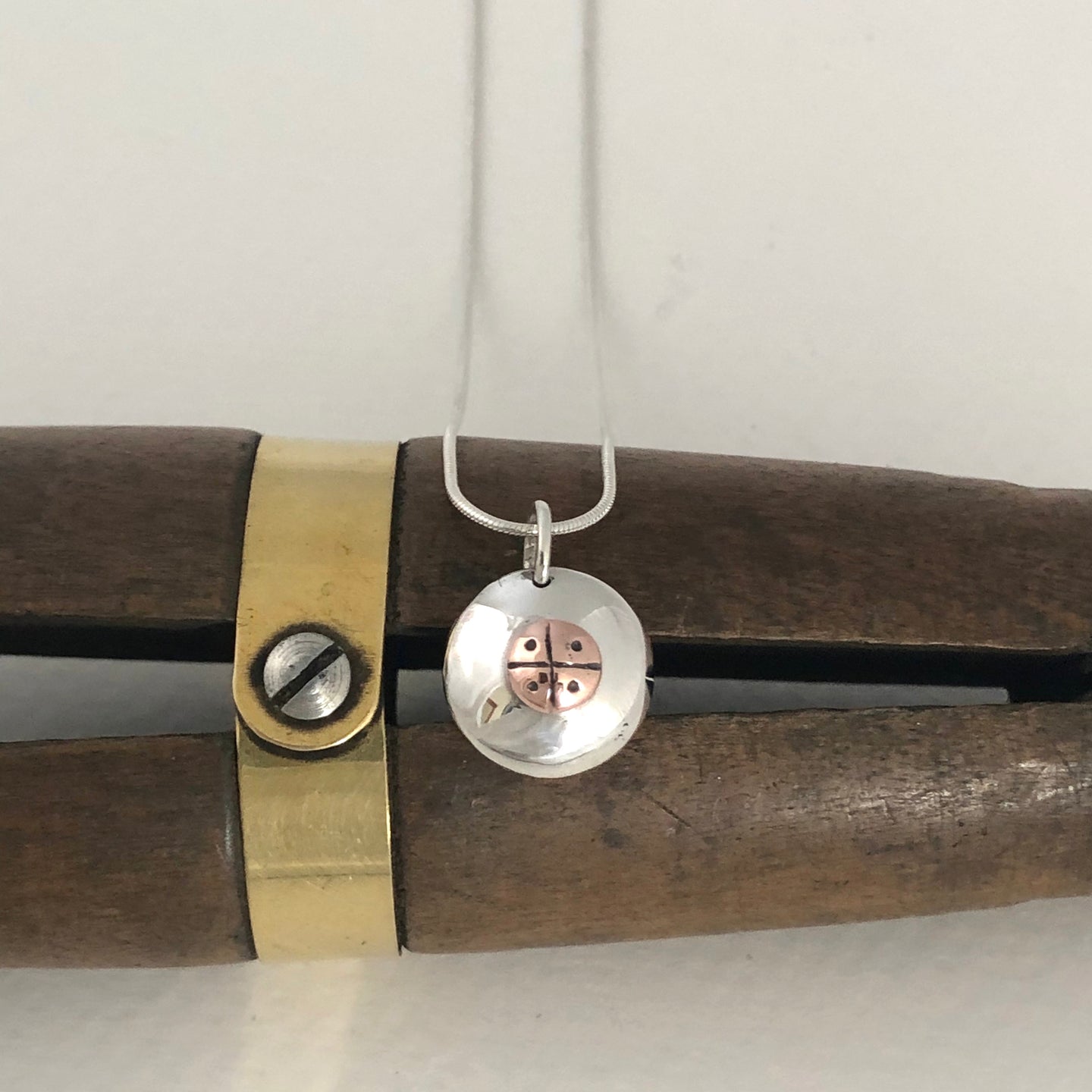 Silver and copper pendant