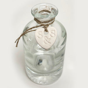 White ceramic rose in a bottle