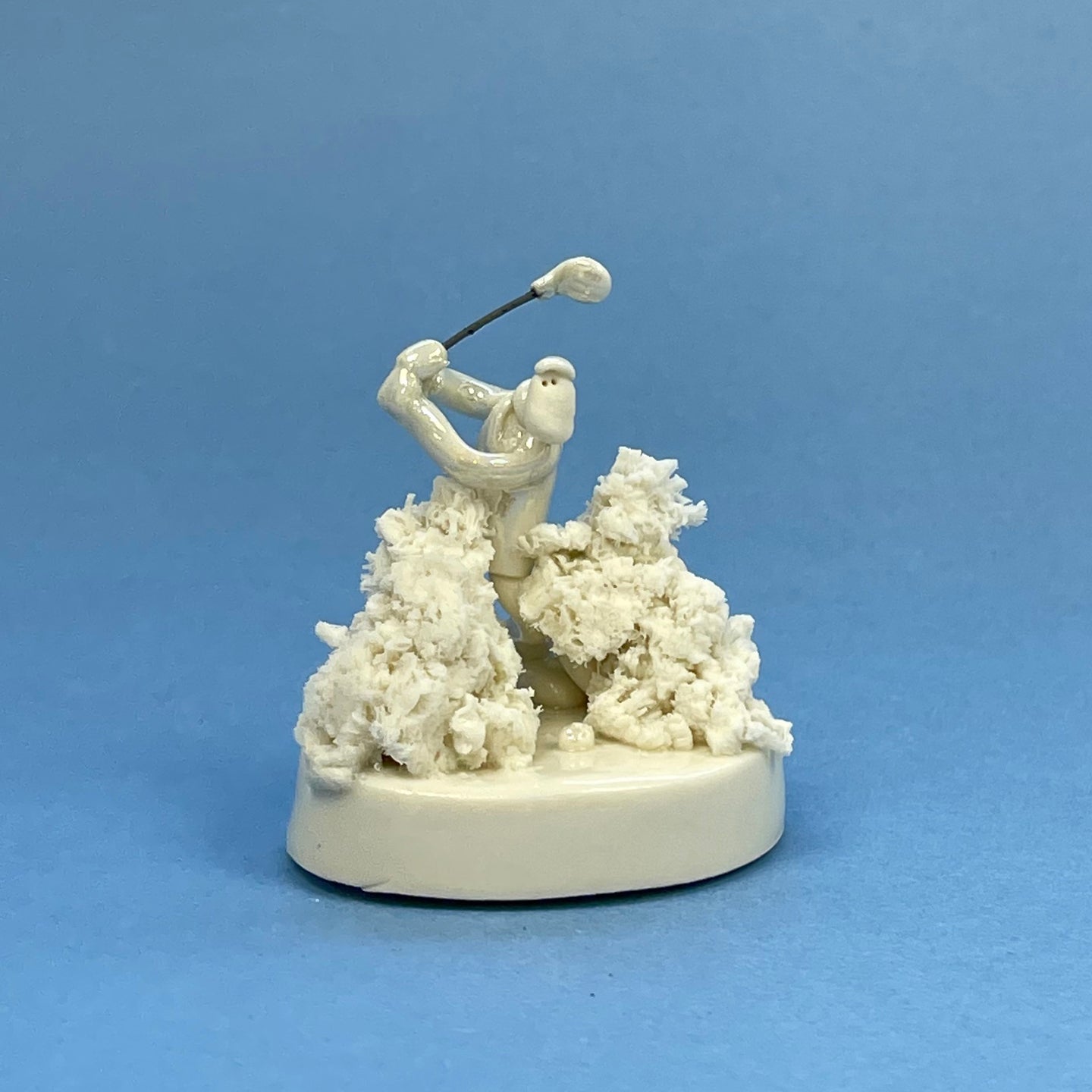 Ceramic sculpture - golfer in the rough