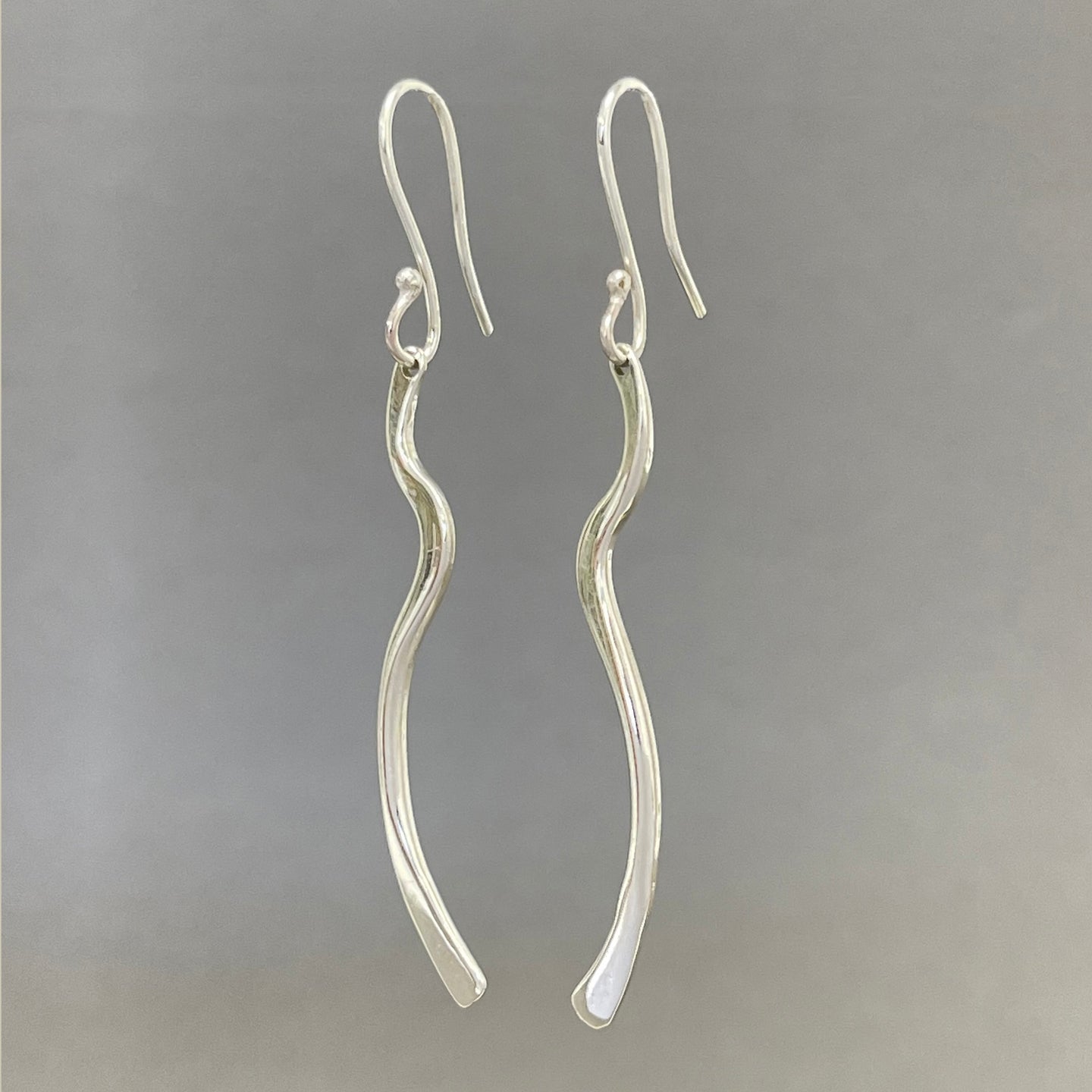 Silver long single wave earrings