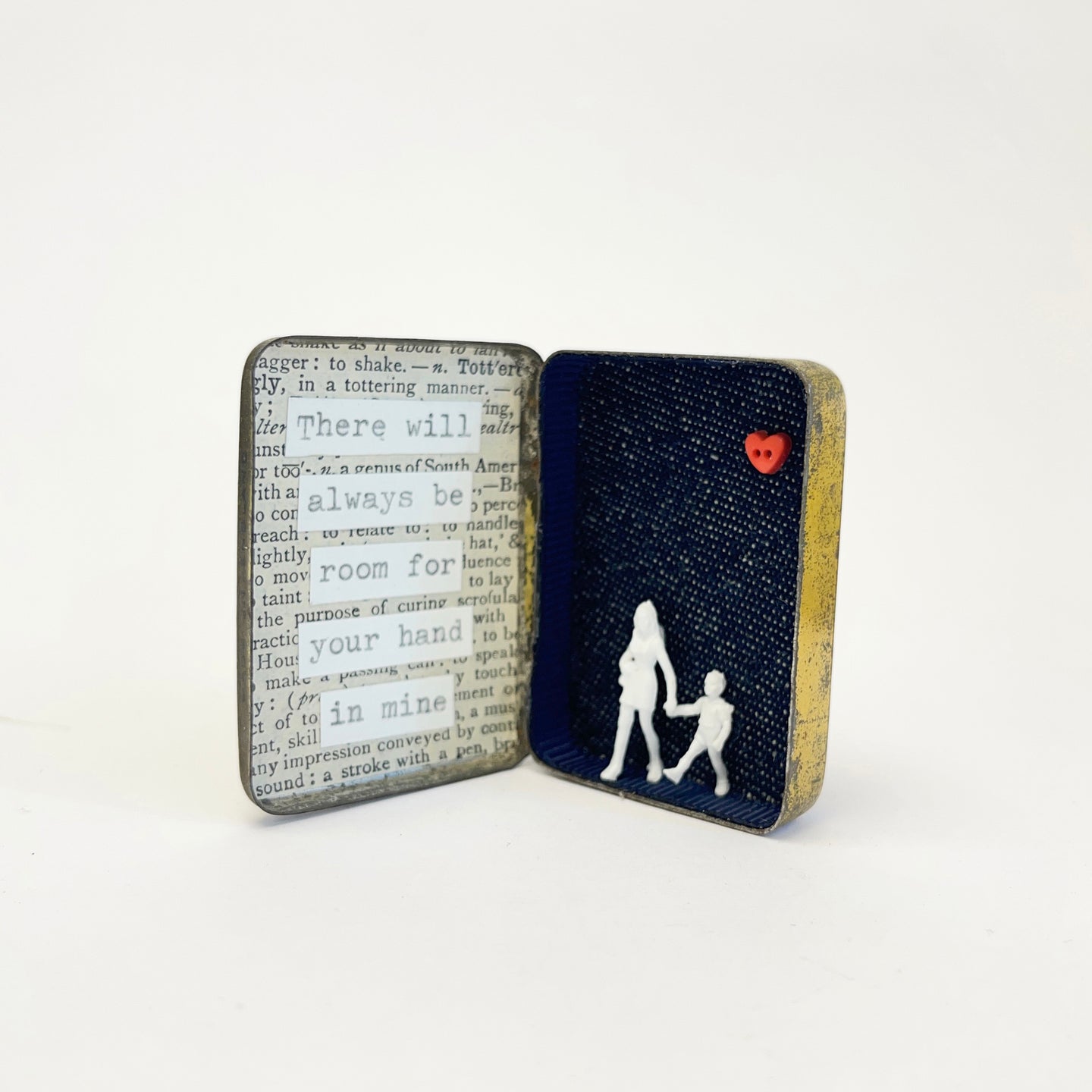 Hand in mine trinket tin