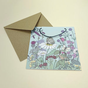 Card with butterfly necklace