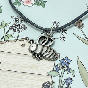 Card with bee necklace