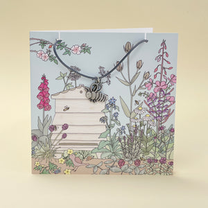 Card with bee necklace