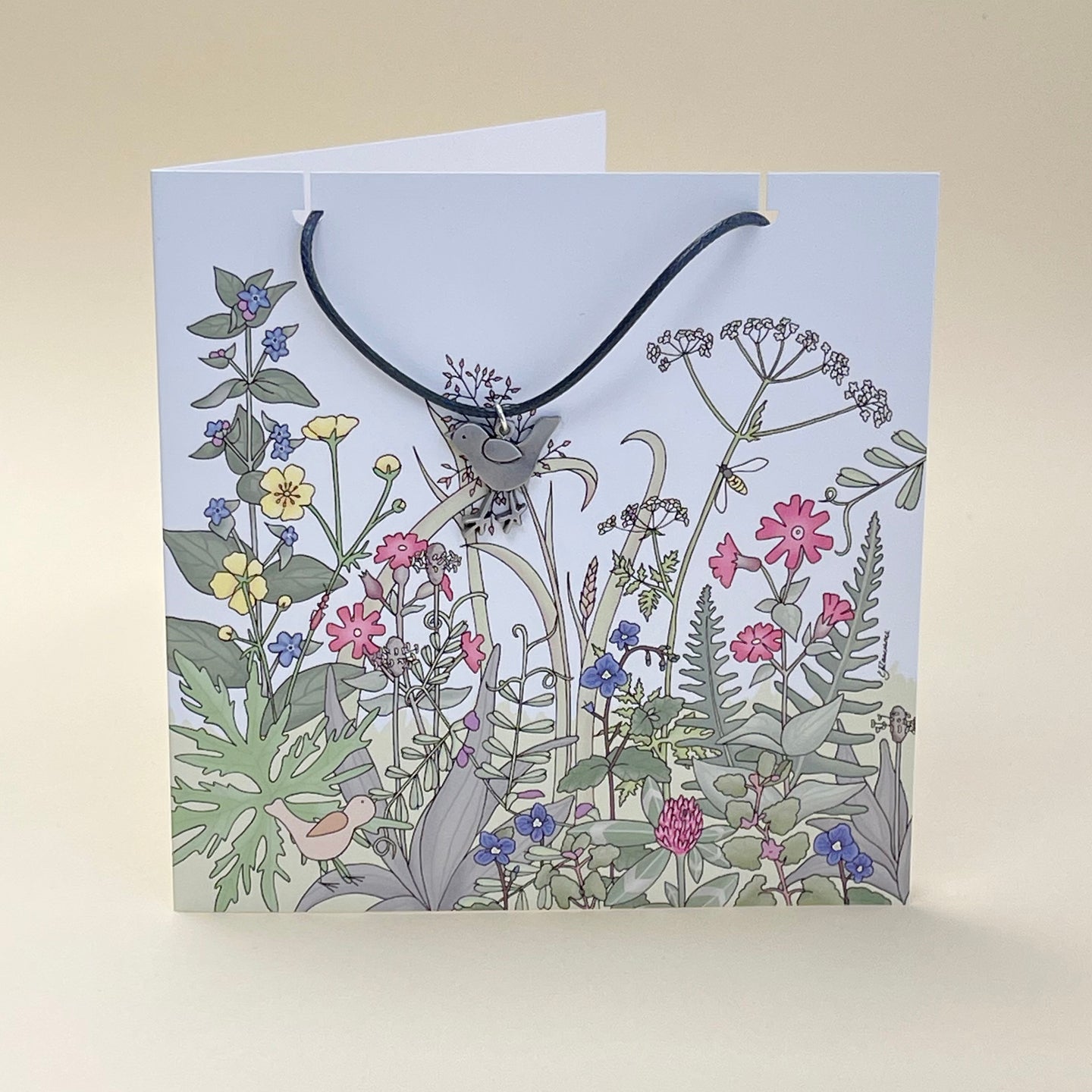 Card with bird necklace