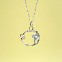 Load image into Gallery viewer, Bronze flower and silver bird hoop pendant
