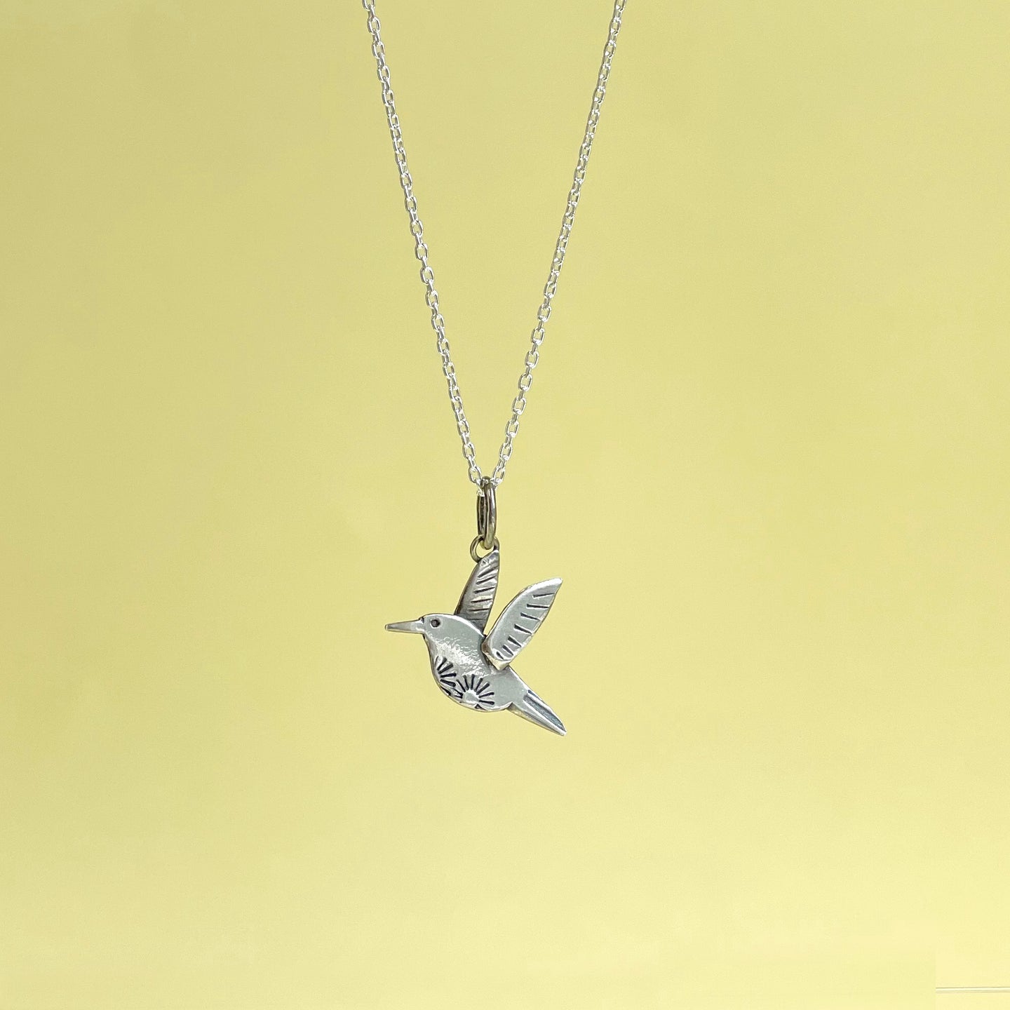 Silver humming bird pendant