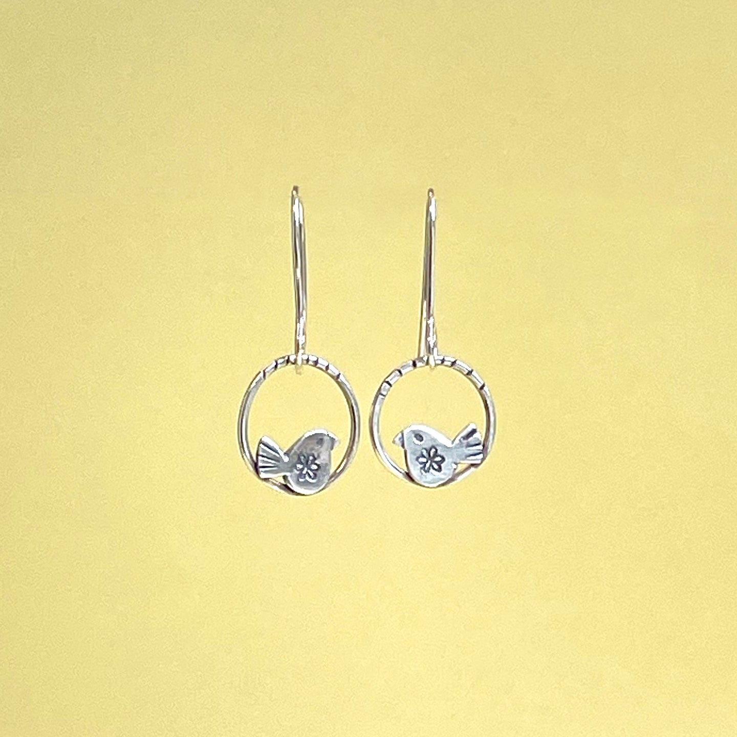 Silver bird in hoop drop earrings