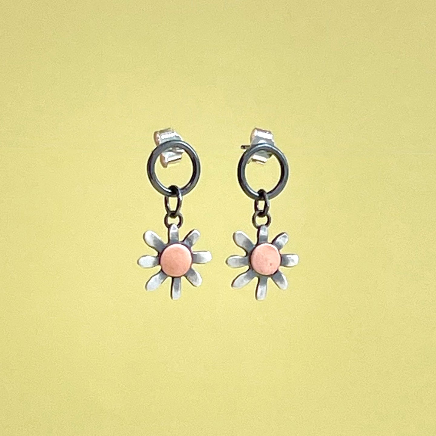 Silver sunflower stud/drop with copper detail.
