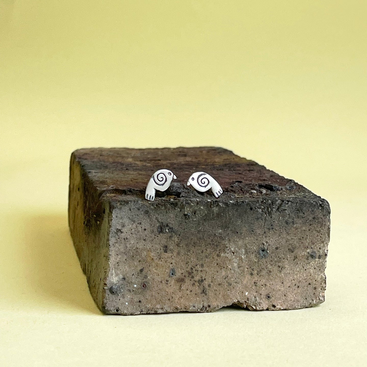 Bird with spiral silver stud earrings