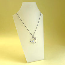 Load image into Gallery viewer, Silver bird in hoop with bronze flower pendant 2
