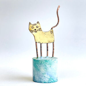 Little cat on plinth