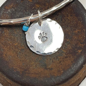 Silver hammered bangle - paw print