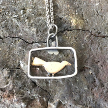 Load image into Gallery viewer, Bronze blackbird in silver frame pendant

