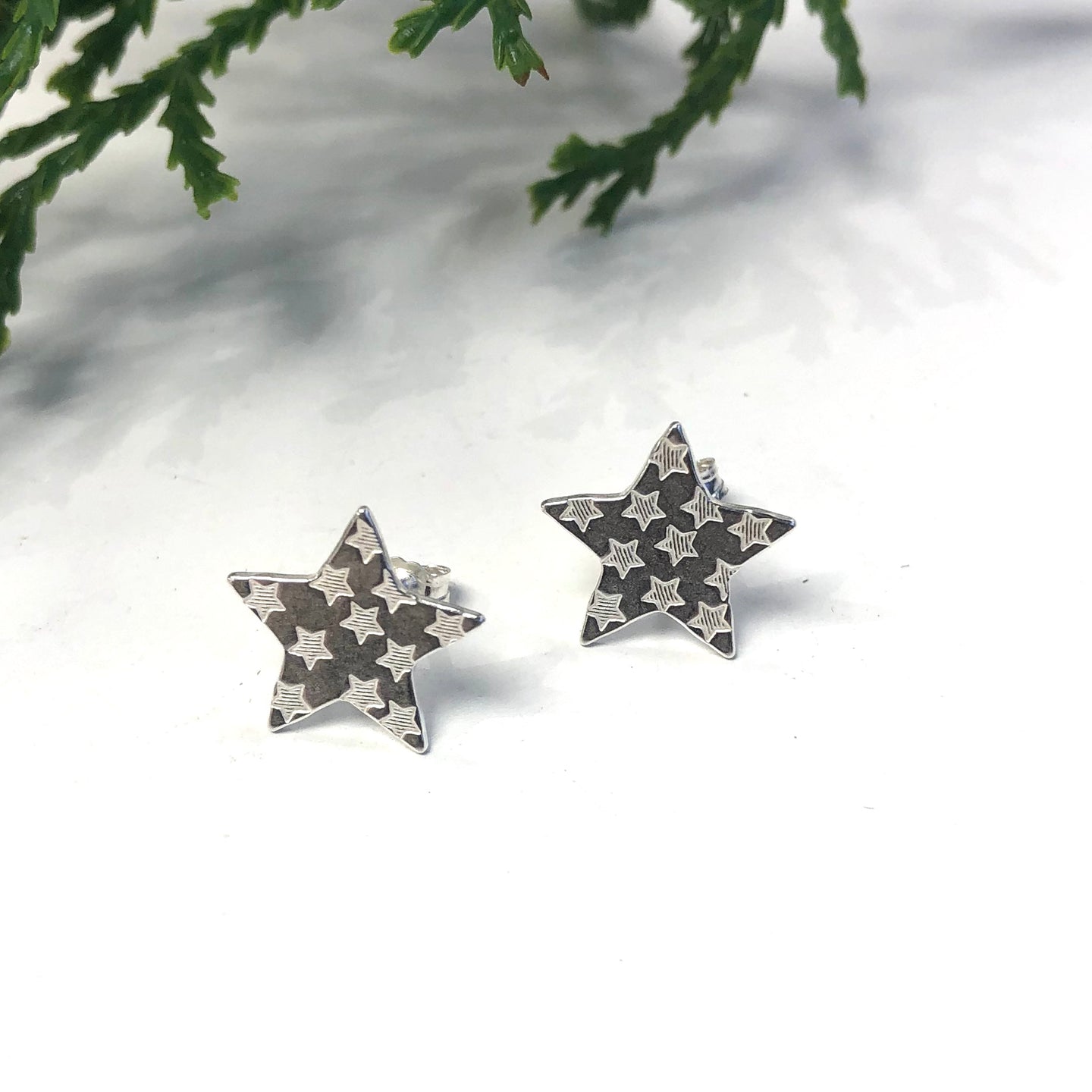 Silver stud earrings - star