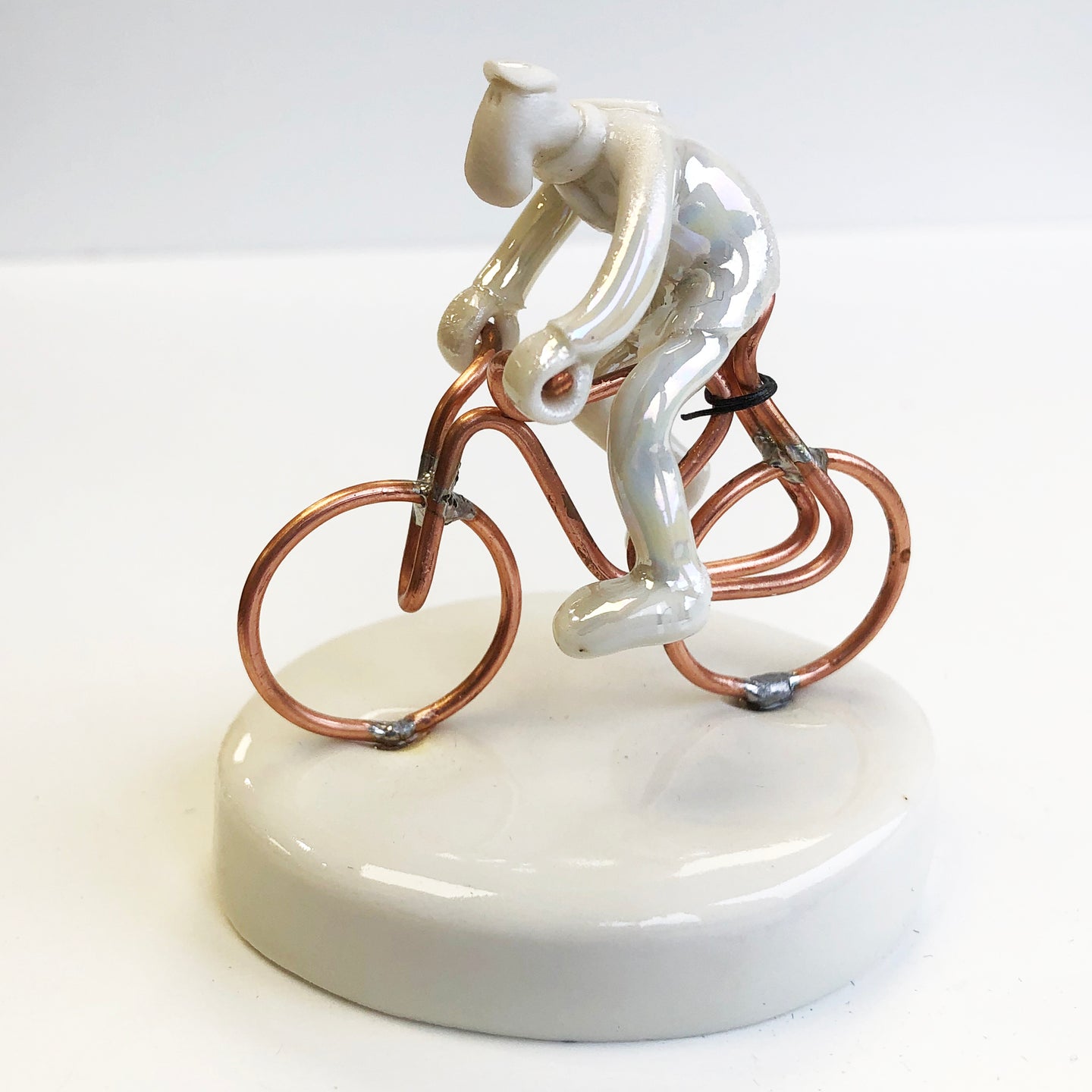 Porcelain man on a bike