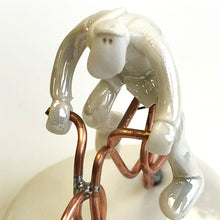 Load image into Gallery viewer, Porcelain man on a bike
