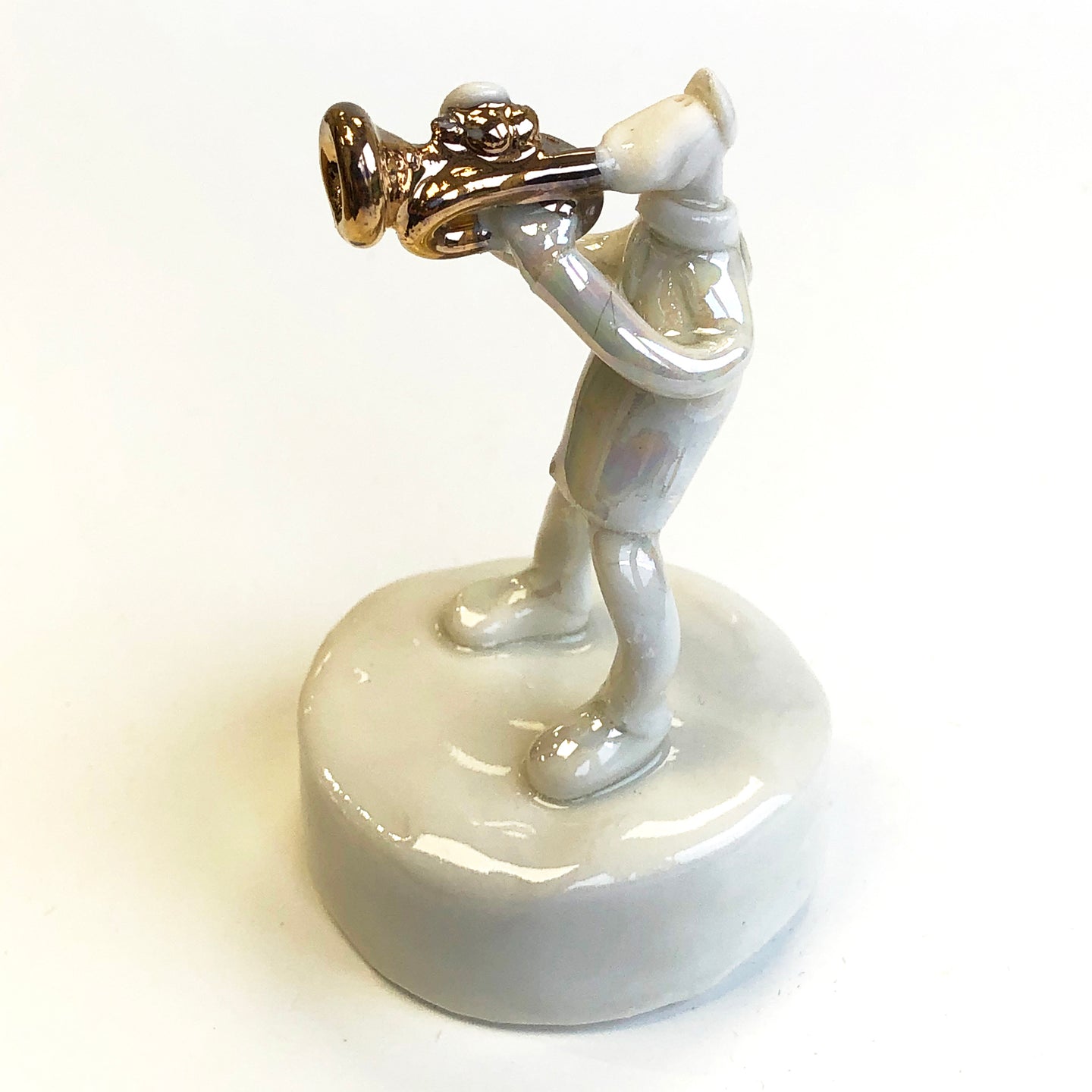 Porcelain trumpet player