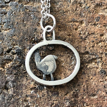 Load image into Gallery viewer, Silver robin pendant with bronze daisy
