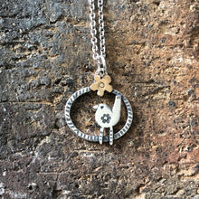 Load image into Gallery viewer, Silver robin pendant with bronze daisy
