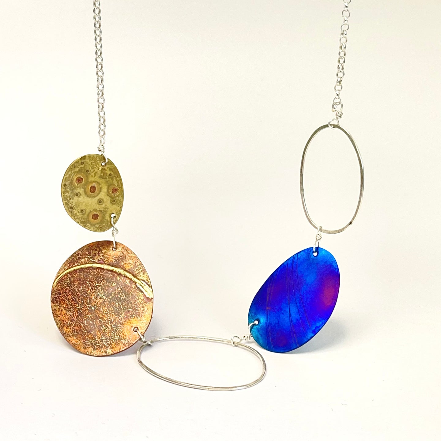 Silver, copper and titanium pendant e