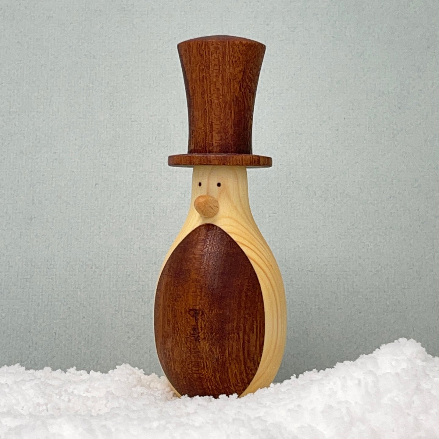 Recycled wooden penguin with top hat